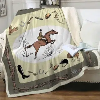 Couverture imprimée sur le thème de l'équitation sur un canapé