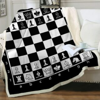 Plaid jeu d'échecs noir te blanc sur un canapé