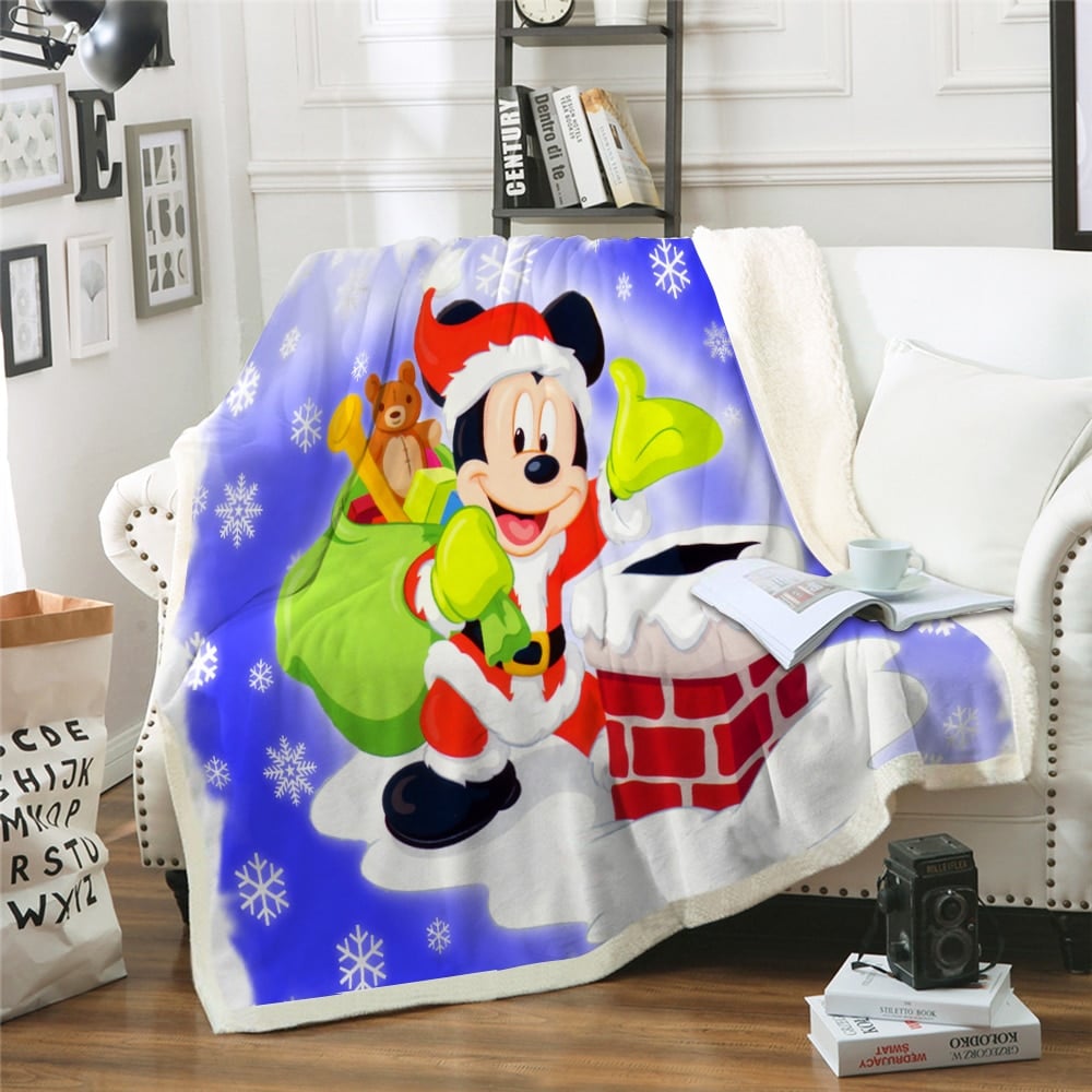 Plaid Disney Merry Christmas motif Mickey sur un canapé blanc
