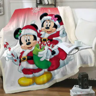 Plaid Merry Christmas Mickey et Minnie sur un canapé blanc