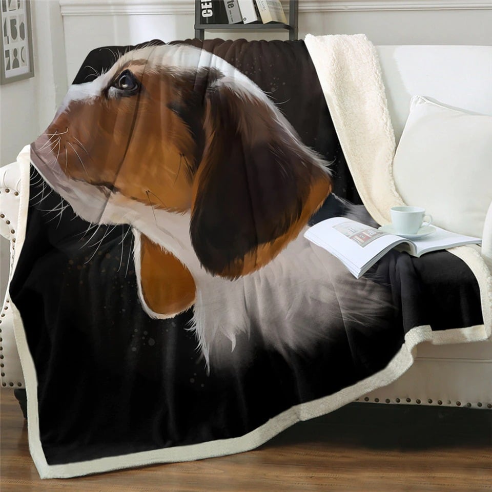 Plaid noir avec motif tête de chien sur un canapé