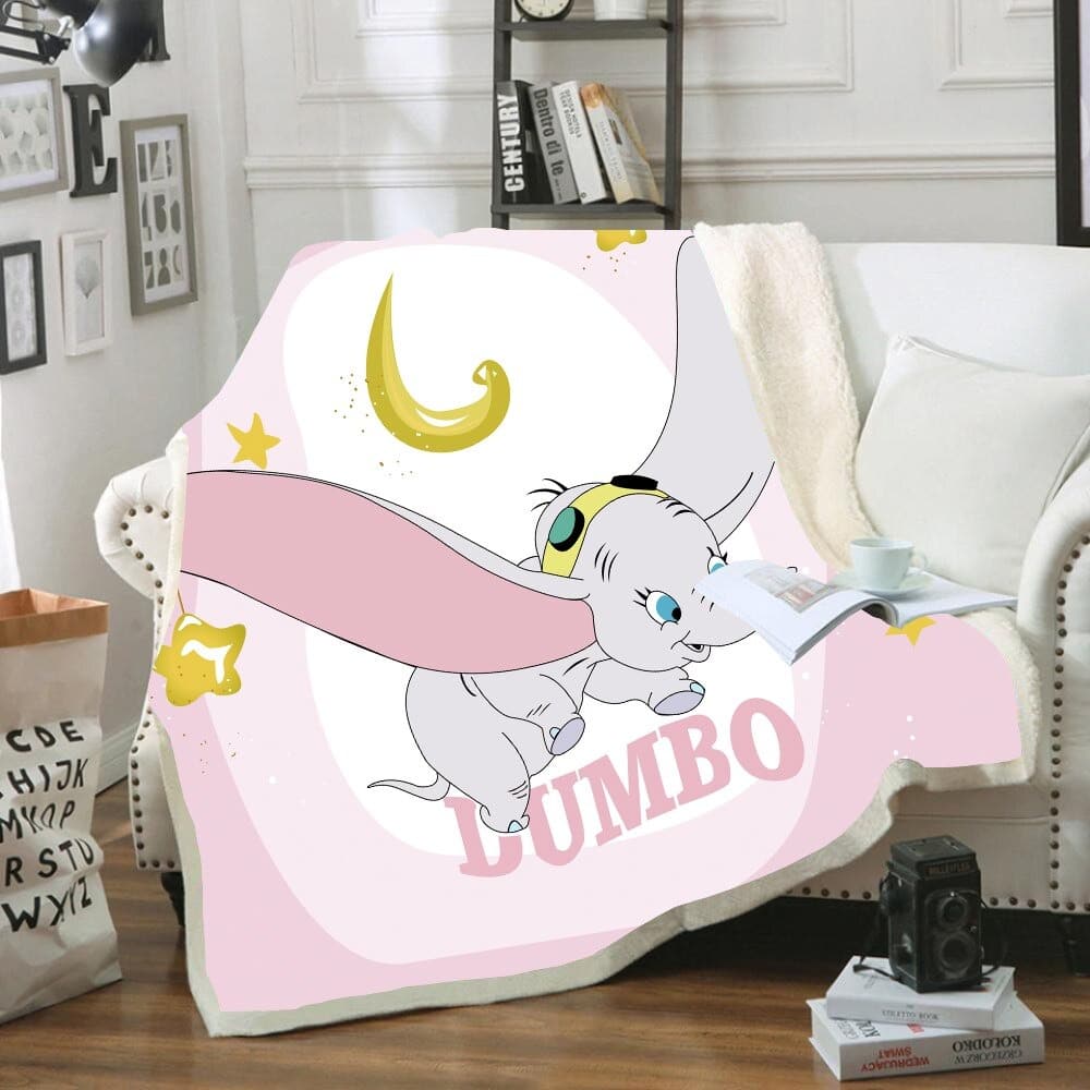 Plaid Dumbo rose et blanc sur canapé dans un salon
