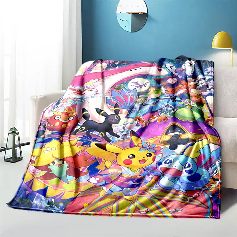Plaid Pokémon multicolores installé sur un canapé
