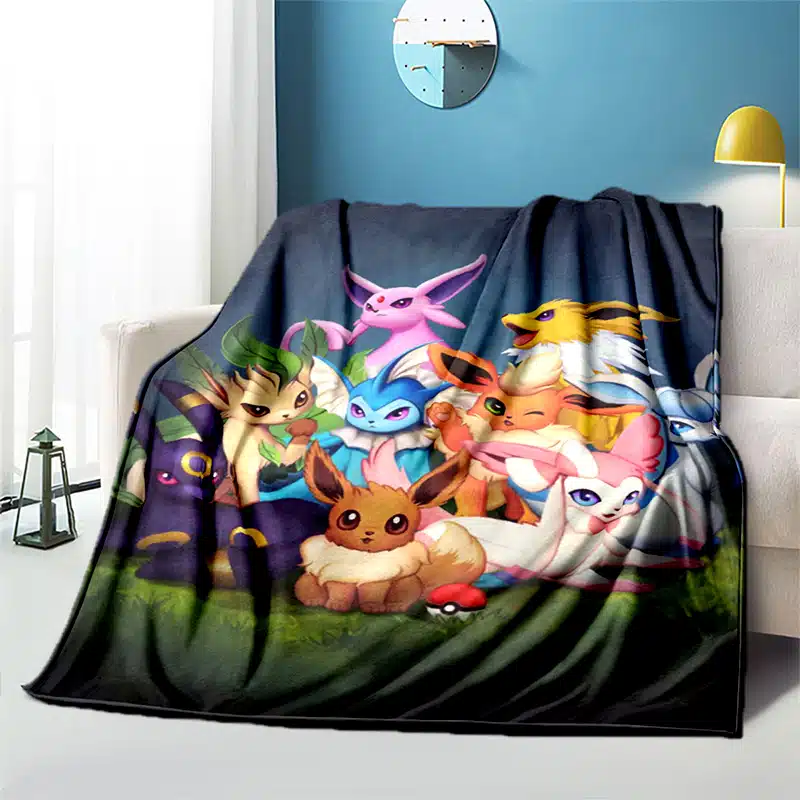 Plaid Pokémon prêts à combattre installé sur un canapé
